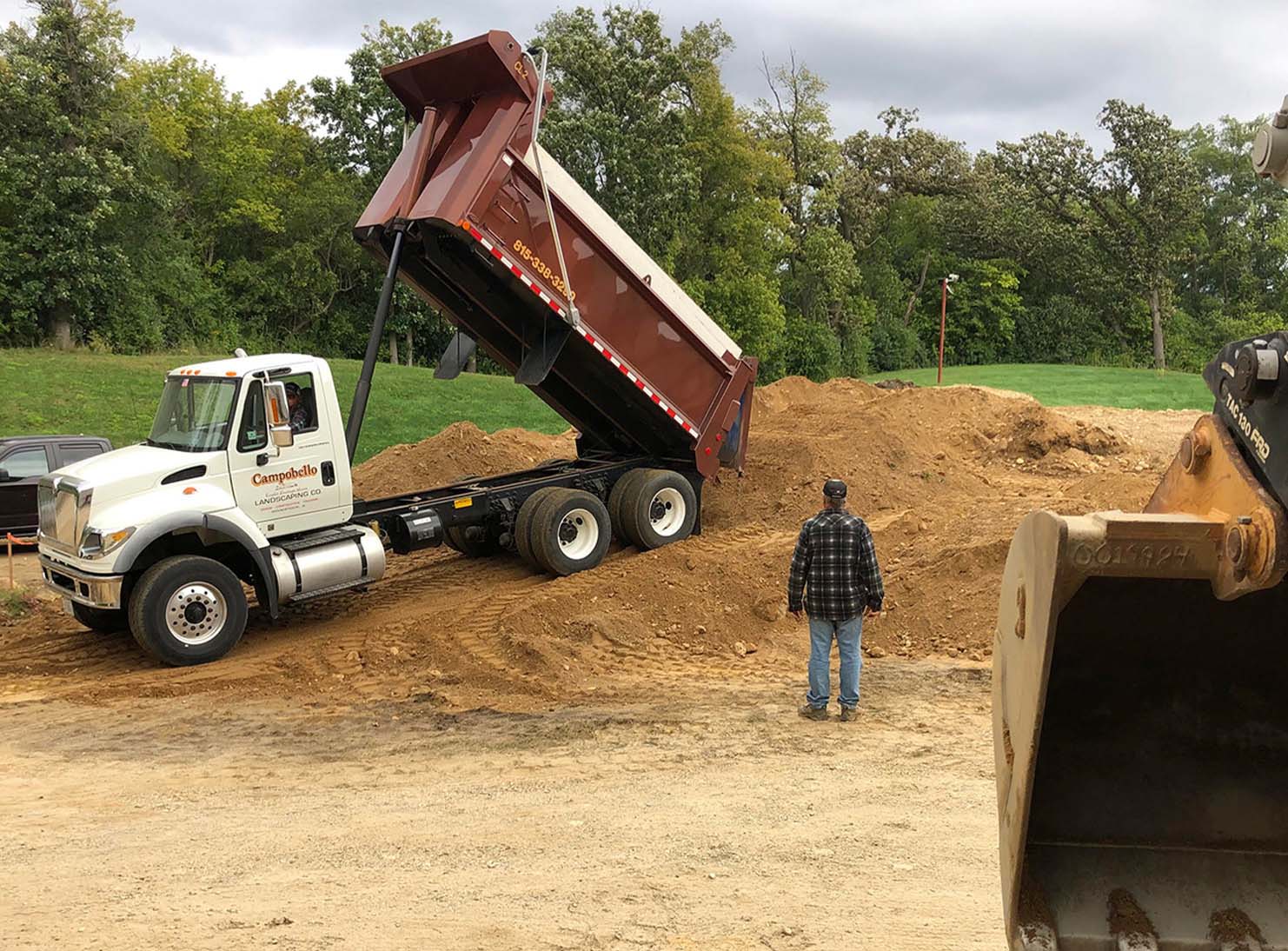 Dump truck dumping dirt out